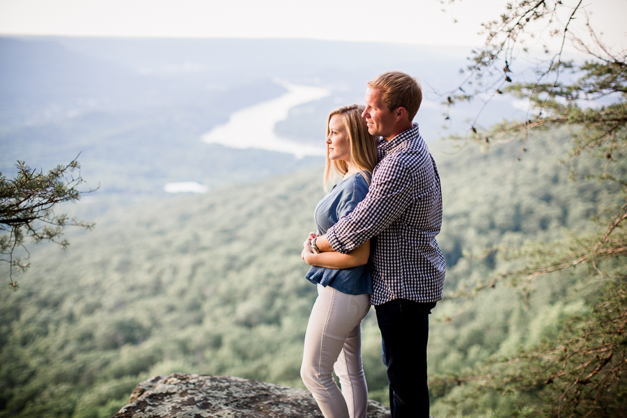 Holding her from behind looking at view at Sunset Rock in Chattanooga by Knoxville Wedding Photographer Amanda May Photos.