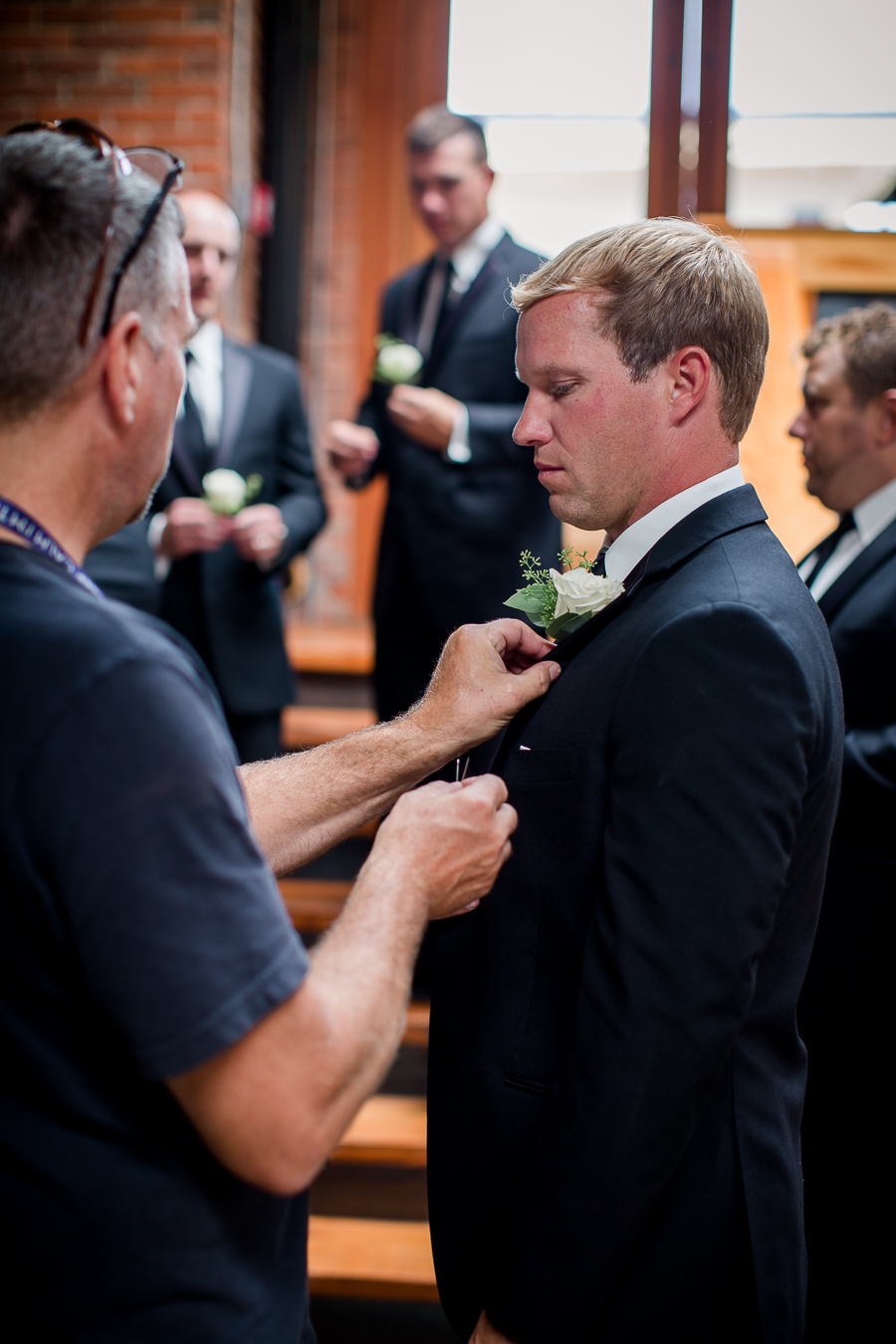 Groom getting flower put on at this wedding at The Standard by Knoxville Wedding Photographer, Amanda May Photos.