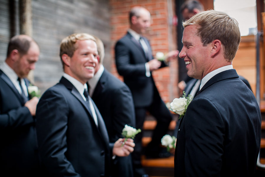 Groom and twin brother laughing at this wedding at The Standard by Knoxville Wedding Photographer, Amanda May Photos.