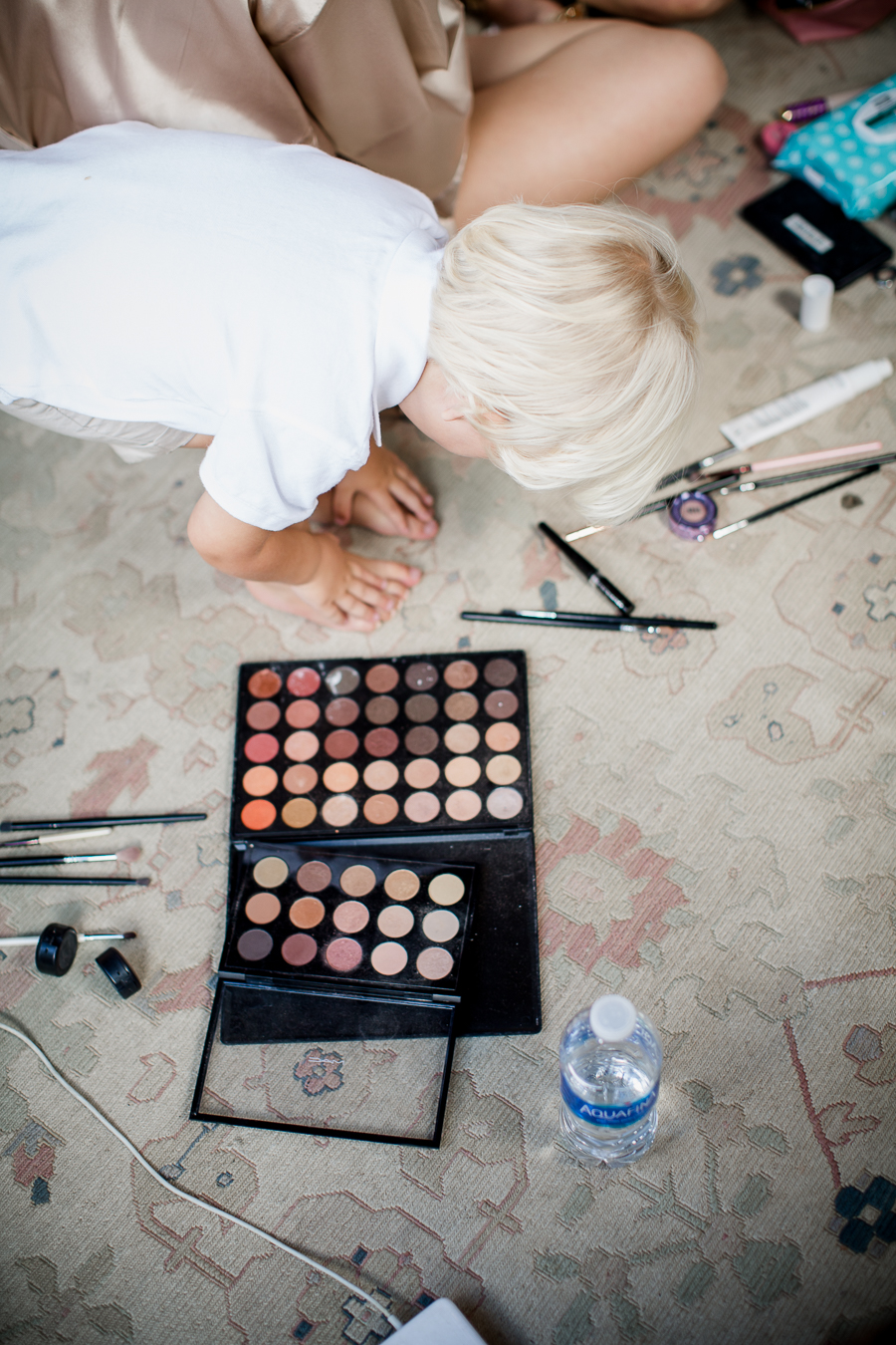 Little boy playing next to makeup at this wedding at The Standard by Knoxville Wedding Photographer, Amanda May Photos.