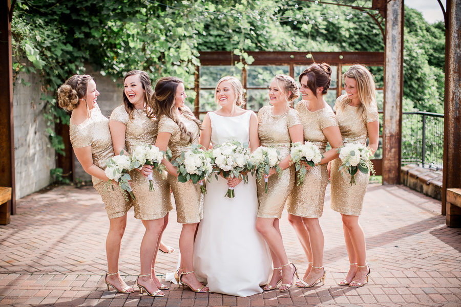 Bride laughing with bridesmaids at this wedding at The Standard by Knoxville Wedding Photographer, Amanda May Photos.