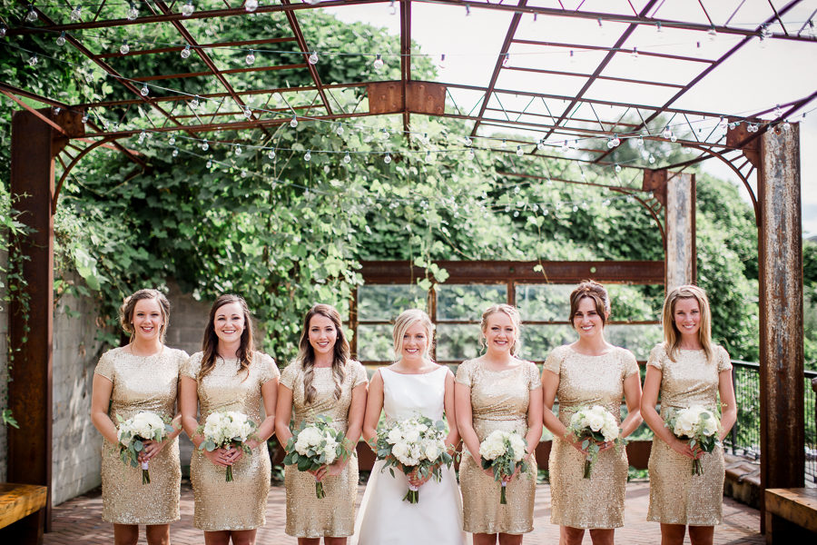 Bride standing front with bridesmaids at this wedding at The Standard by Knoxville Wedding Photographer, Amanda May Photos.