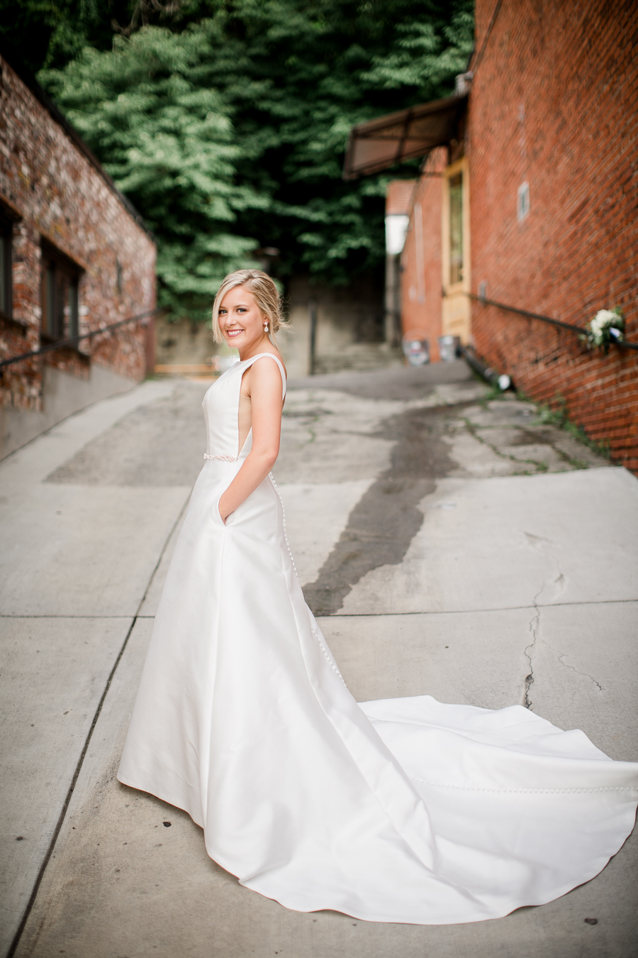 Bride with hands in pockets at this wedding at The Standard by Knoxville Wedding Photographer, Amanda May Photos.
