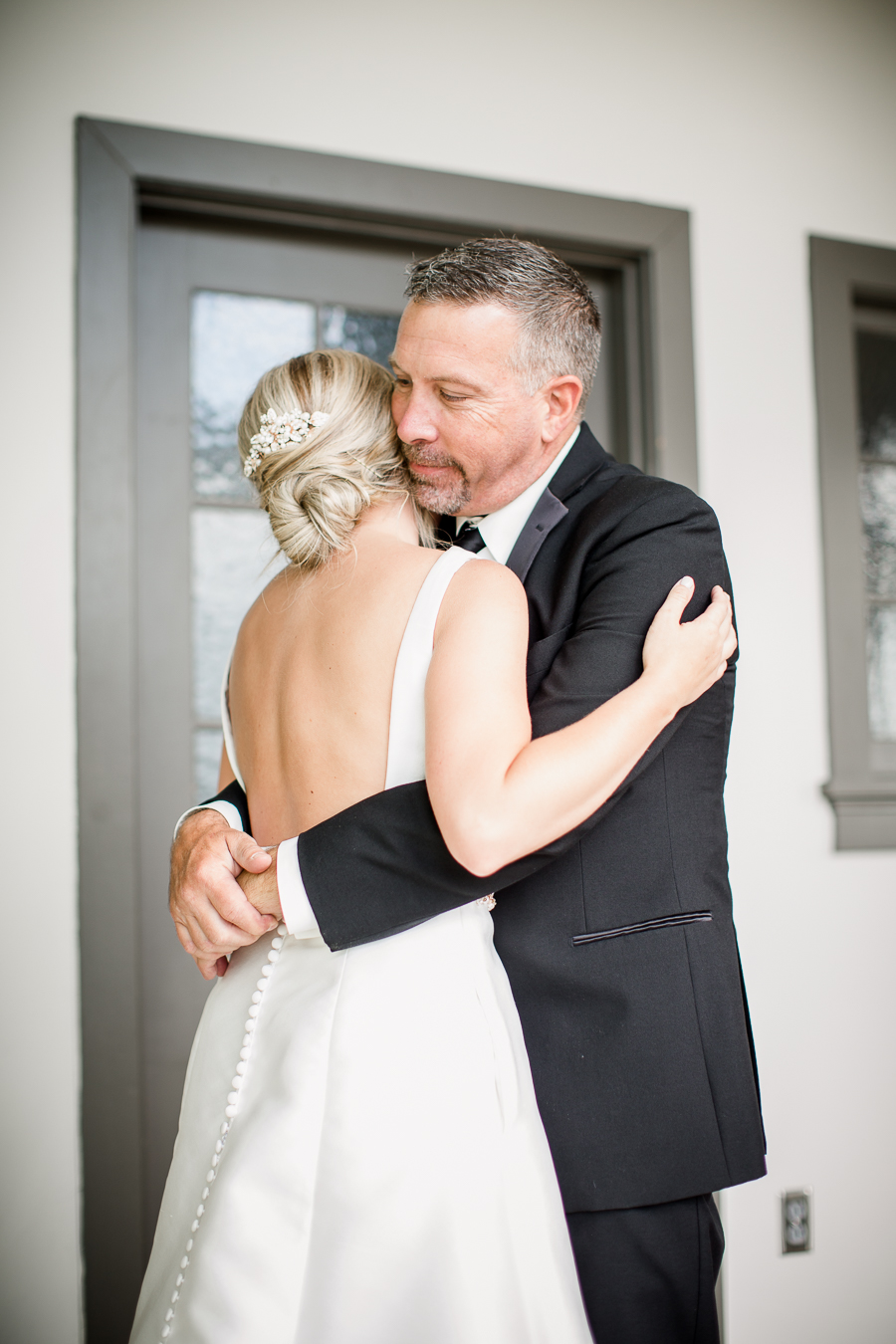 Bride hugging father at this wedding at The Standard by Knoxville Wedding Photographer, Amanda May Photos.