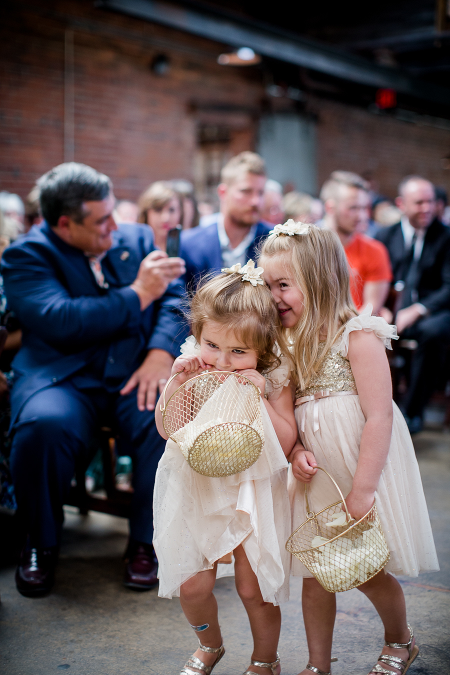 Flower girls walking down aisle at this wedding at The Standard by Knoxville Wedding Photographer, Amanda May Photos.