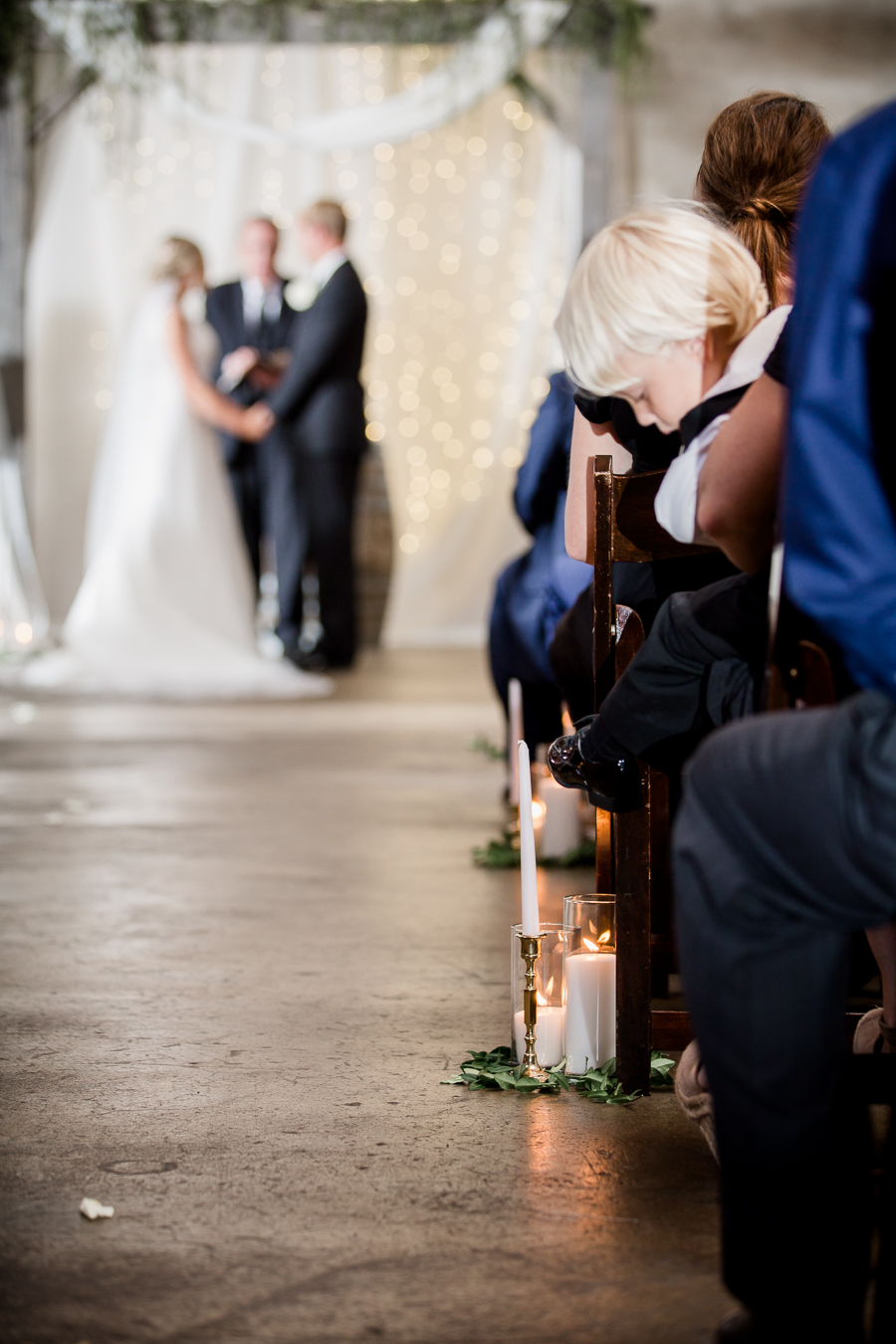 Little boy looking at floor during ceremony at this wedding at The Standard by Knoxville Wedding Photographer, Amanda May Photos.