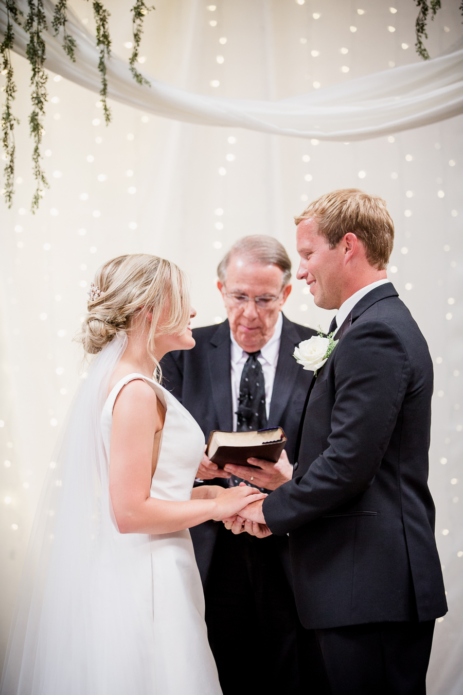 Holding hands during ceremony at this wedding at The Standard by Knoxville Wedding Photographer, Amanda May Photos.
