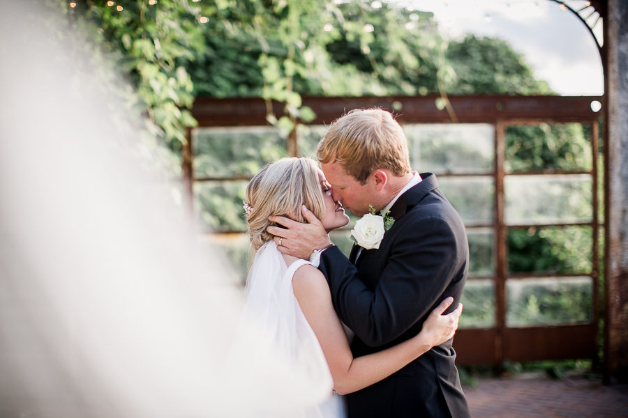 Bride and groom kissing at this wedding at The Standard by Knoxville Wedding Photographer, Amanda May Photos.