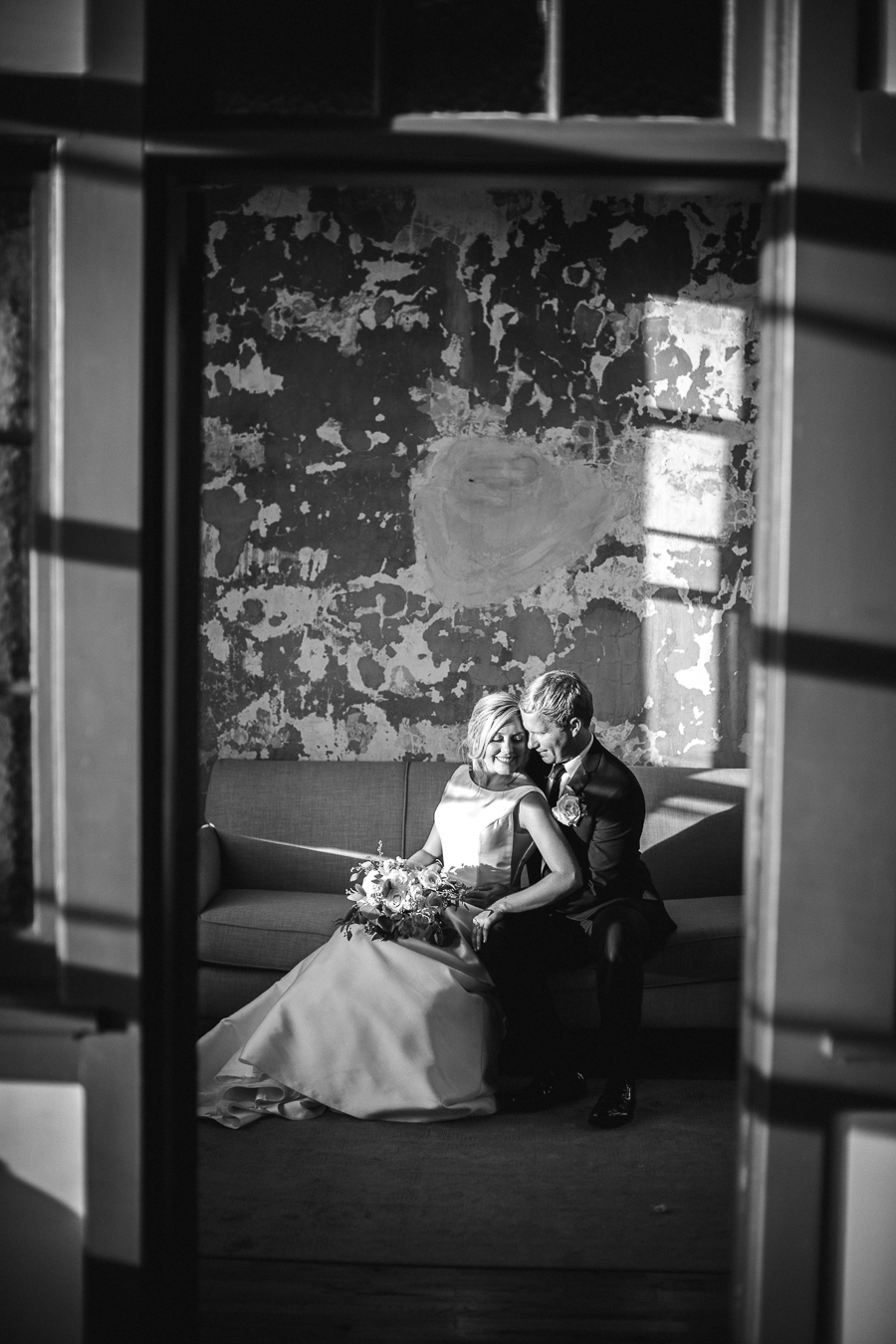 Black and white of sitting on couch at this wedding at The Standard by Knoxville Wedding Photographer, Amanda May Photos.