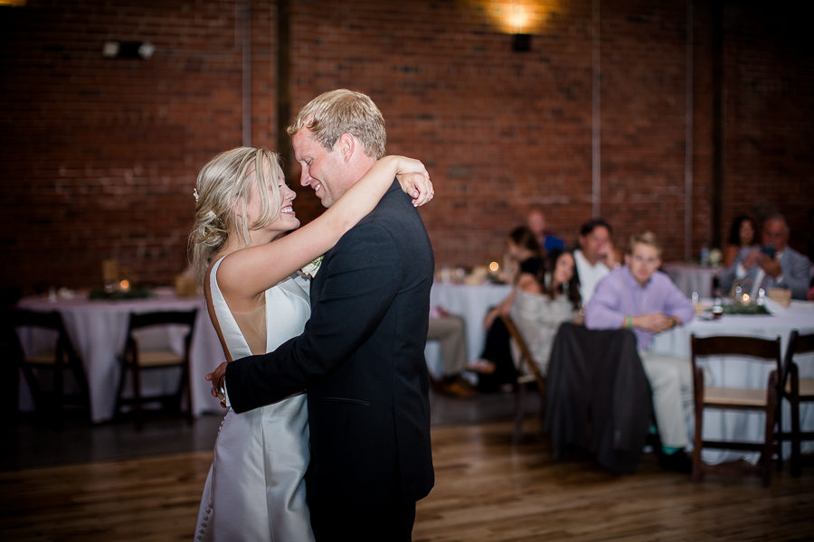 Smiling at each other during first dance at this wedding at The Standard by Knoxville Wedding Photographer, Amanda May Photos.