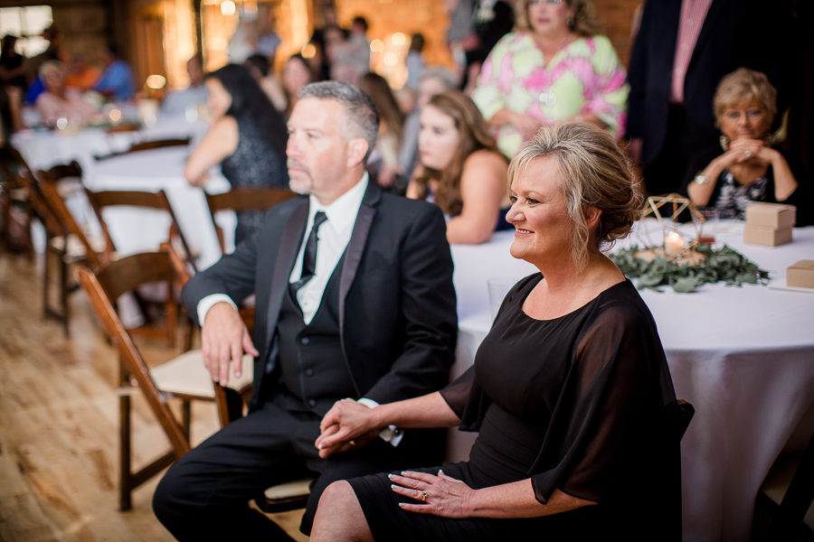 Mother and Father holding hands at this wedding at The Standard by Knoxville Wedding Photographer, Amanda May Photos.