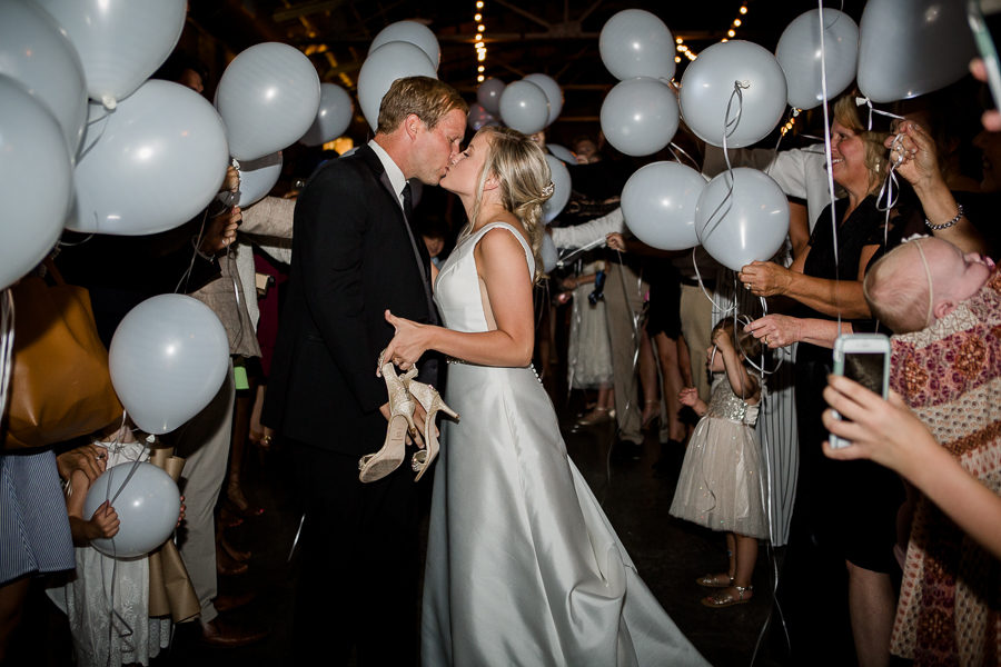 Kissing with balloons at this wedding at The Standard by Knoxville Wedding Photographer, Amanda May Photos.