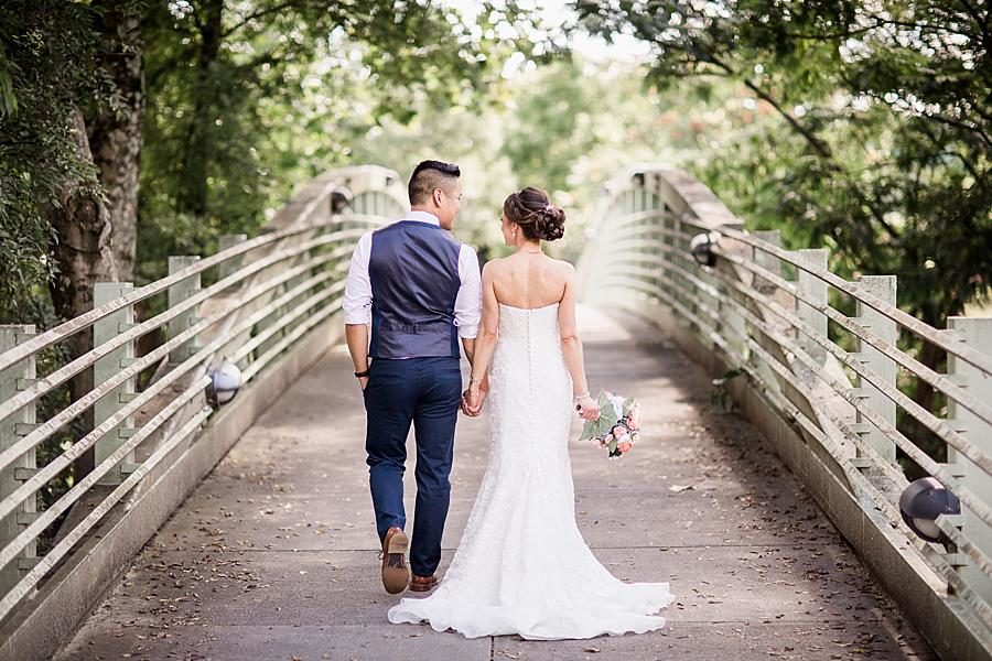 Holding hands at this Calhoun's on the River Wedding by Knoxville Wedding Photographer, Amanda May Photos.