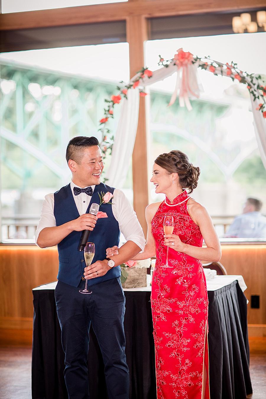 Holding the microphone at this Calhoun's on the River Wedding by Knoxville Wedding Photographer, Amanda May Photos.
