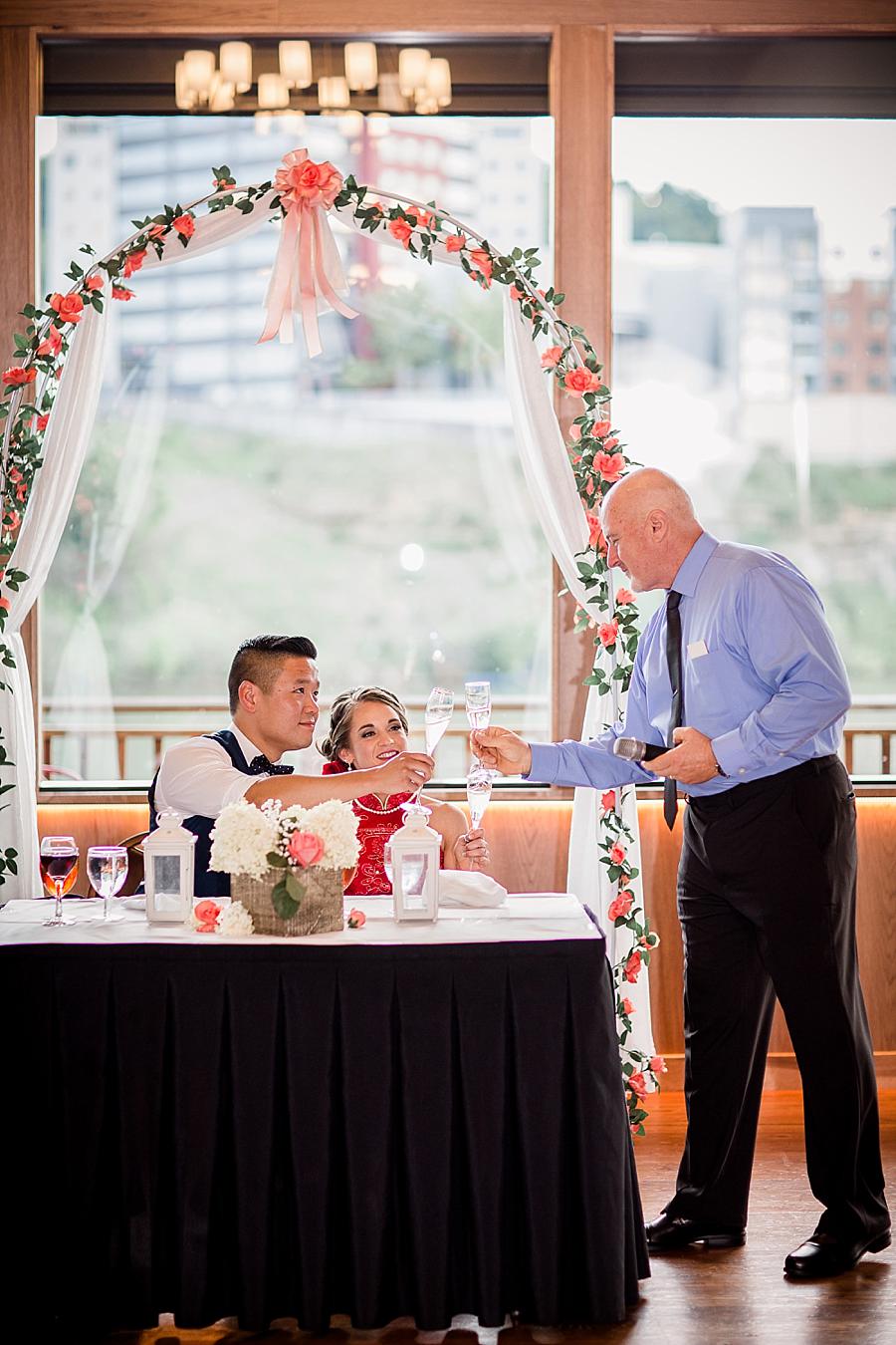 Cheers at this Calhoun's on the River Wedding by Knoxville Wedding Photographer, Amanda May Photos.