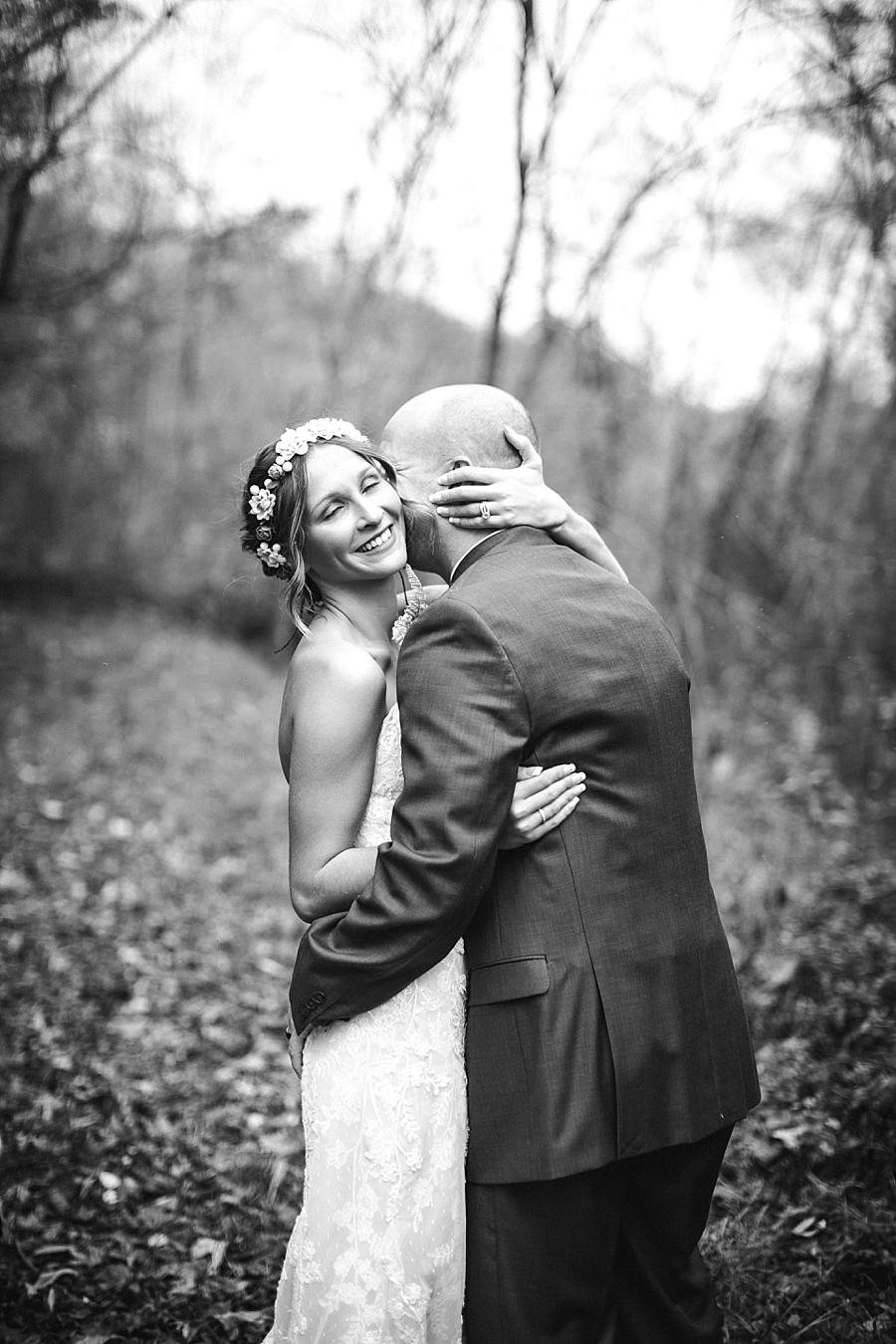 Black and white of Bride holding her Groom at this Alpine Village Wedding Chapel by Knoxville Wedding Photographer, Amanda May Photos.