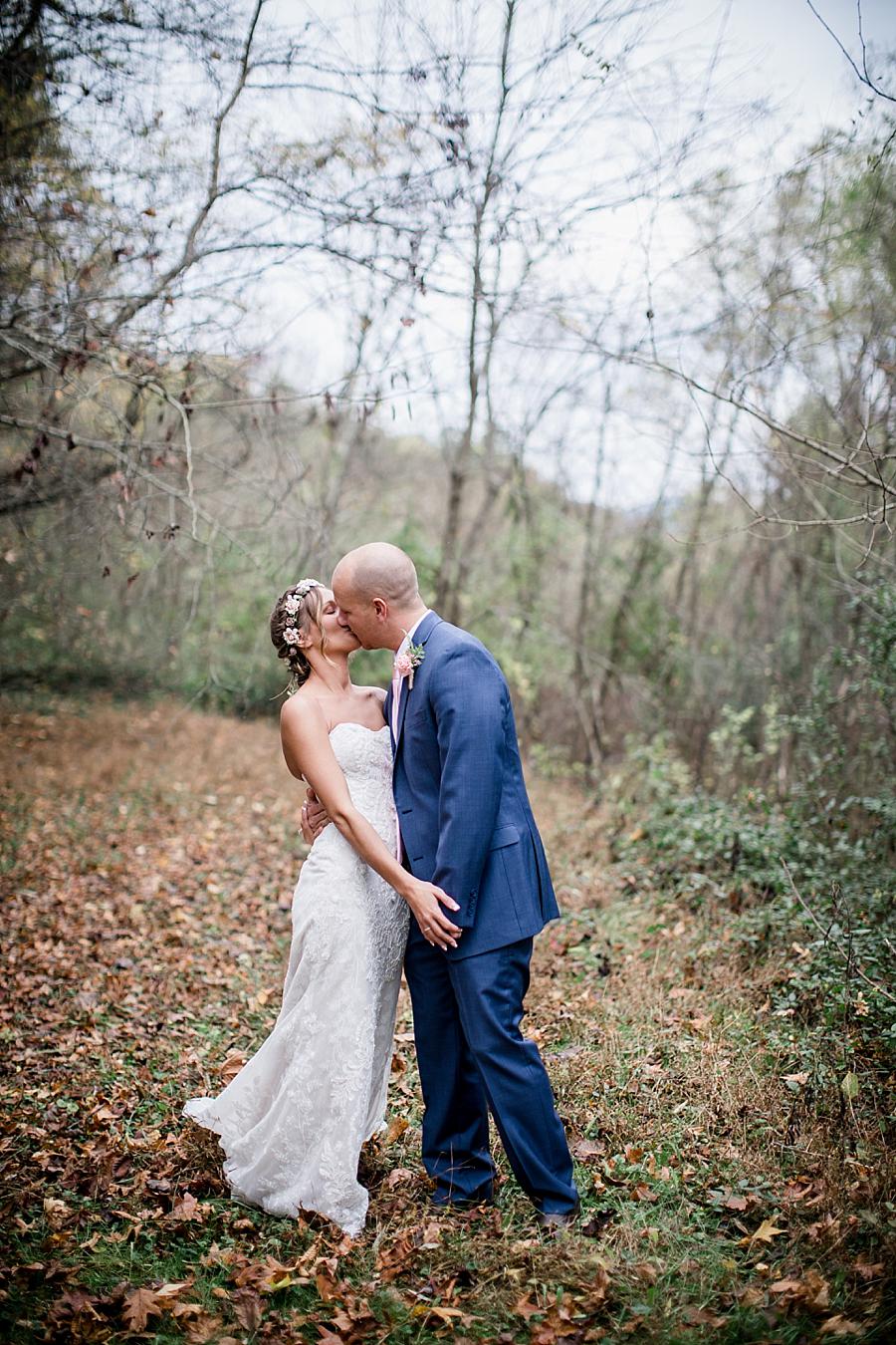 Groom kissing his Bride at this Alpine Village Wedding Chapel by Knoxville Wedding Photographer, Amanda May Photos.