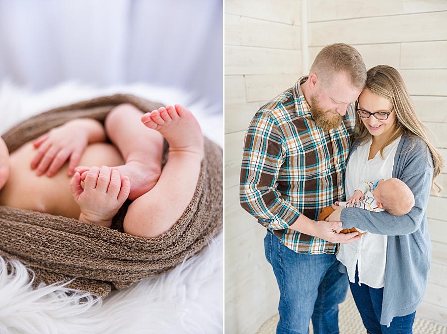 parents holding son at brother newborn session