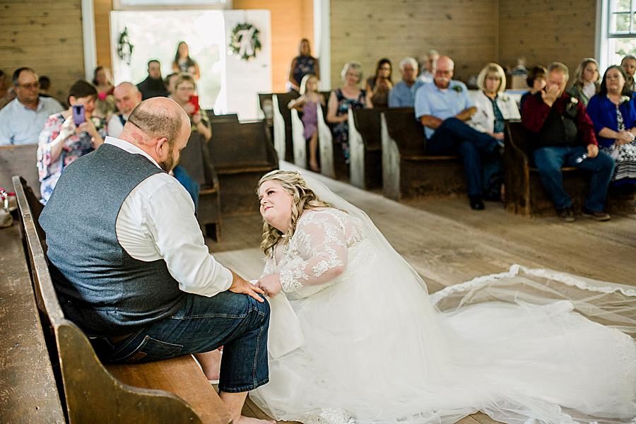 Washing groom’s feet at this Cades Cove wedding by Knoxville Wedding Photographer, Amanda May Photos.