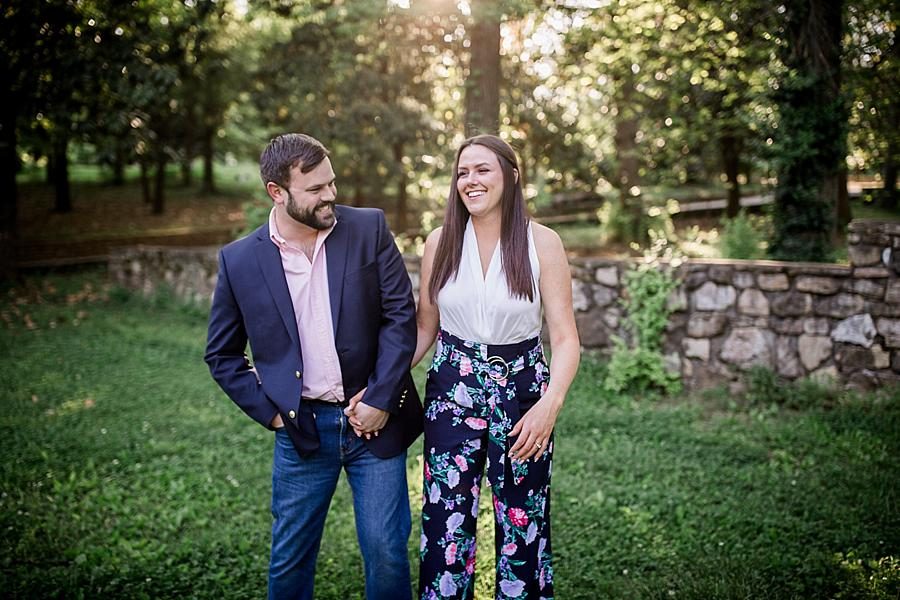 Bumping hips laughing at this Knoxville Botanical Engagement session by Knoxville Wedding Photographer, Amanda May Photos.
