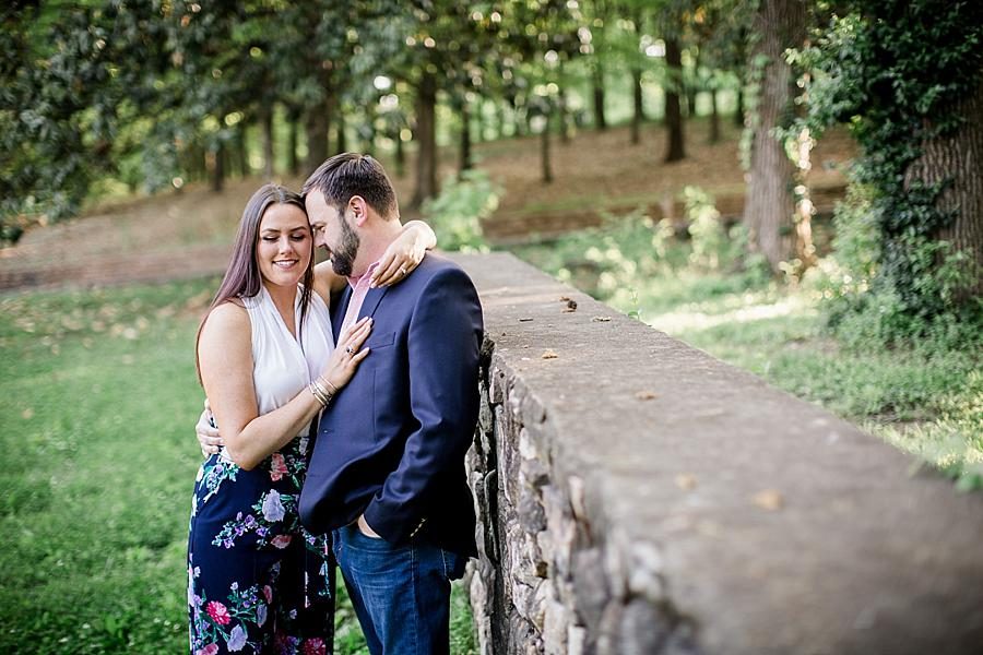 Her arm around his neck at this Knoxville Botanical Engagement session by Knoxville Wedding Photographer, Amanda May Photos.