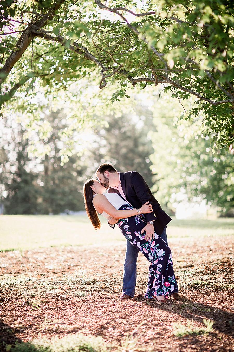 Dipping her at this Knoxville Botanical Engagement session by Knoxville Wedding Photographer, Amanda May Photos.