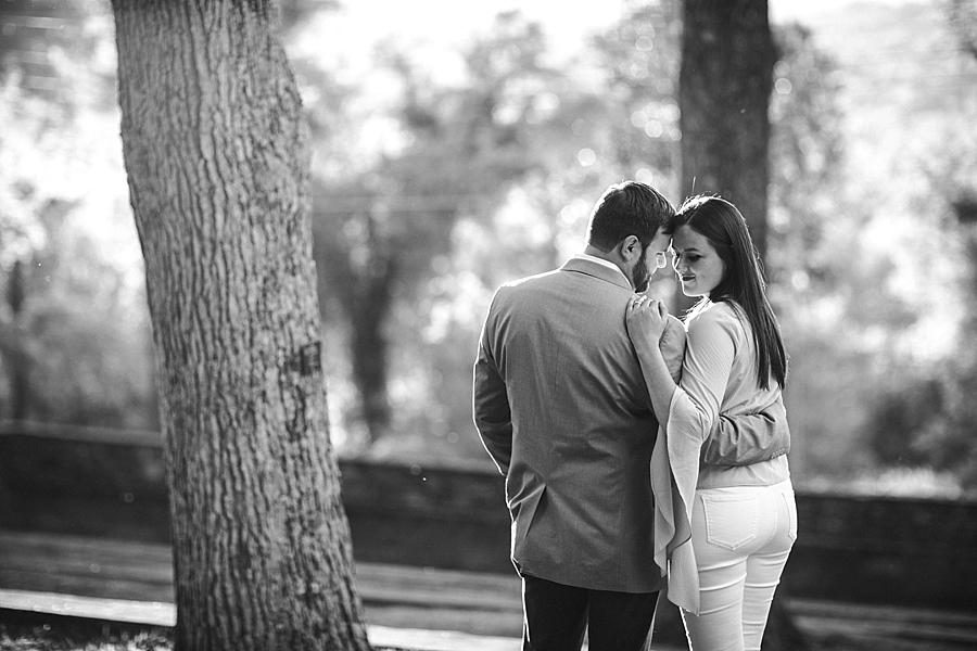 Their back to the camera in black and white at this Knoxville Botanical Engagement session by Knoxville Wedding Photographer, Amanda May Photos.