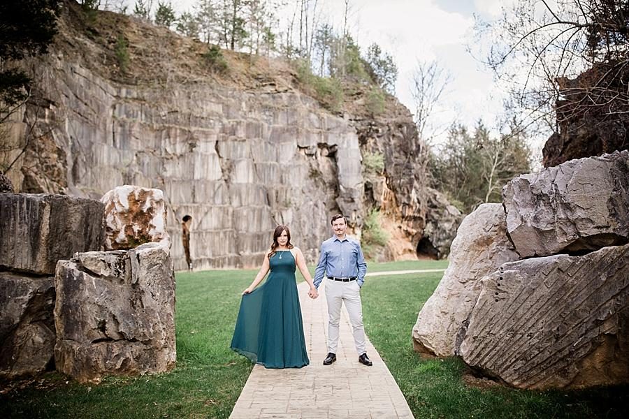 Standing holding hands facing the camera at this Knoxville engagement session at The Quarry by Knoxville Wedding Photographer, Amanda May Photos.