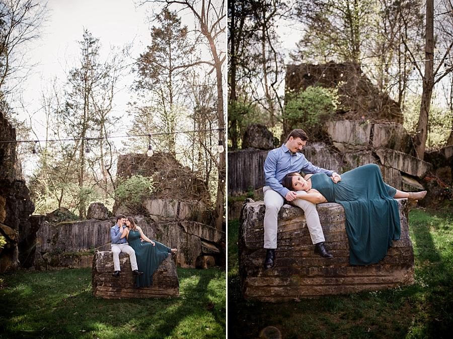 Laying on his lap at this Knoxville engagement session at The Quarry by Knoxville Wedding Photographer, Amanda May Photos.