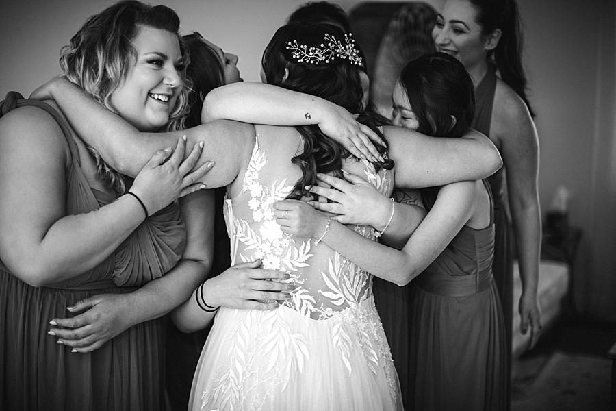 Bridal party hug at this The Quarry wedding by Knoxville Wedding Photographer, Amanda May Photos.