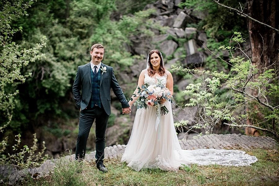 Newlyweds holding hands at this The Quarry wedding by Knoxville Wedding Photographer, Amanda May Photos.
