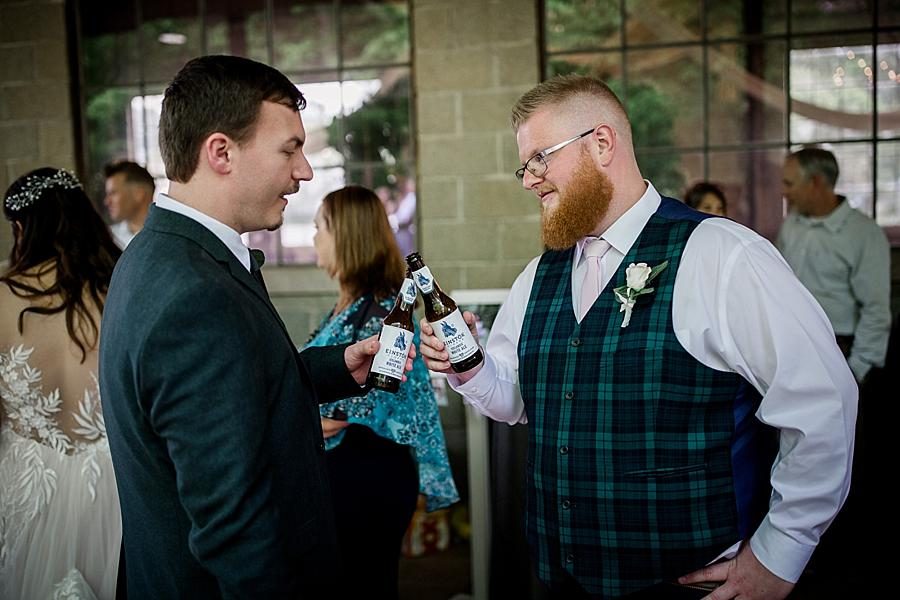 Clinking beers at this The Quarry wedding by Knoxville Wedding Photographer, Amanda May Photos.