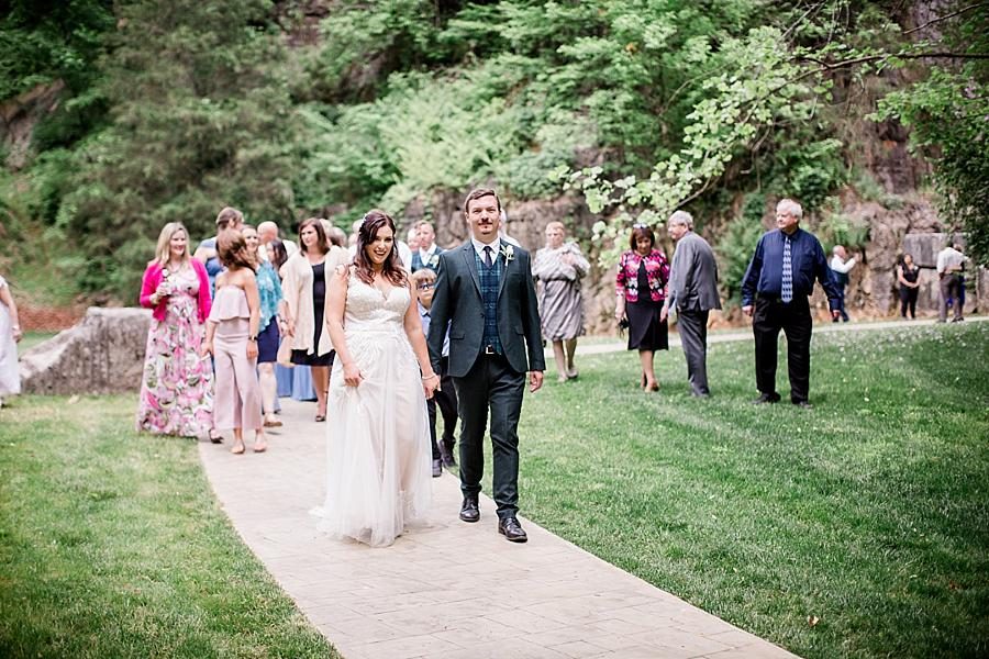 Walking away from the group shot at this The Quarry wedding by Knoxville Wedding Photographer, Amanda May Photos.