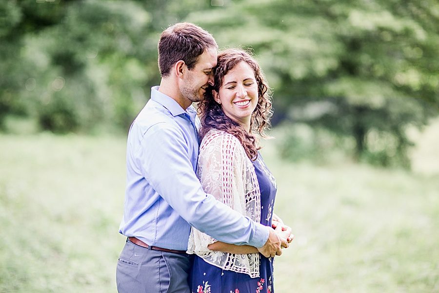 Hug from behind at this engagement at Castleton Farms by Knoxville Wedding Photographer, Amanda May Photos