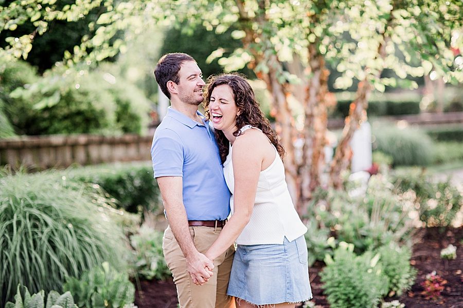 Holding hands and laughing by Knoxville Wedding Photographer, Amanda May Photos