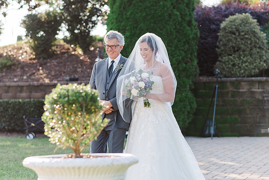 dad walking daughter down the aisle at castleton
