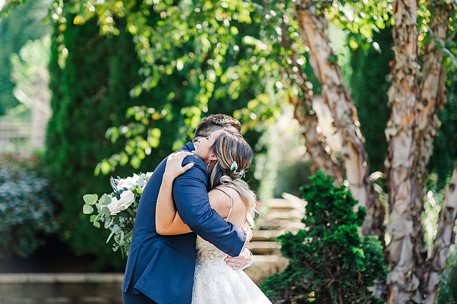 couple hugging at this castleton farms wedding