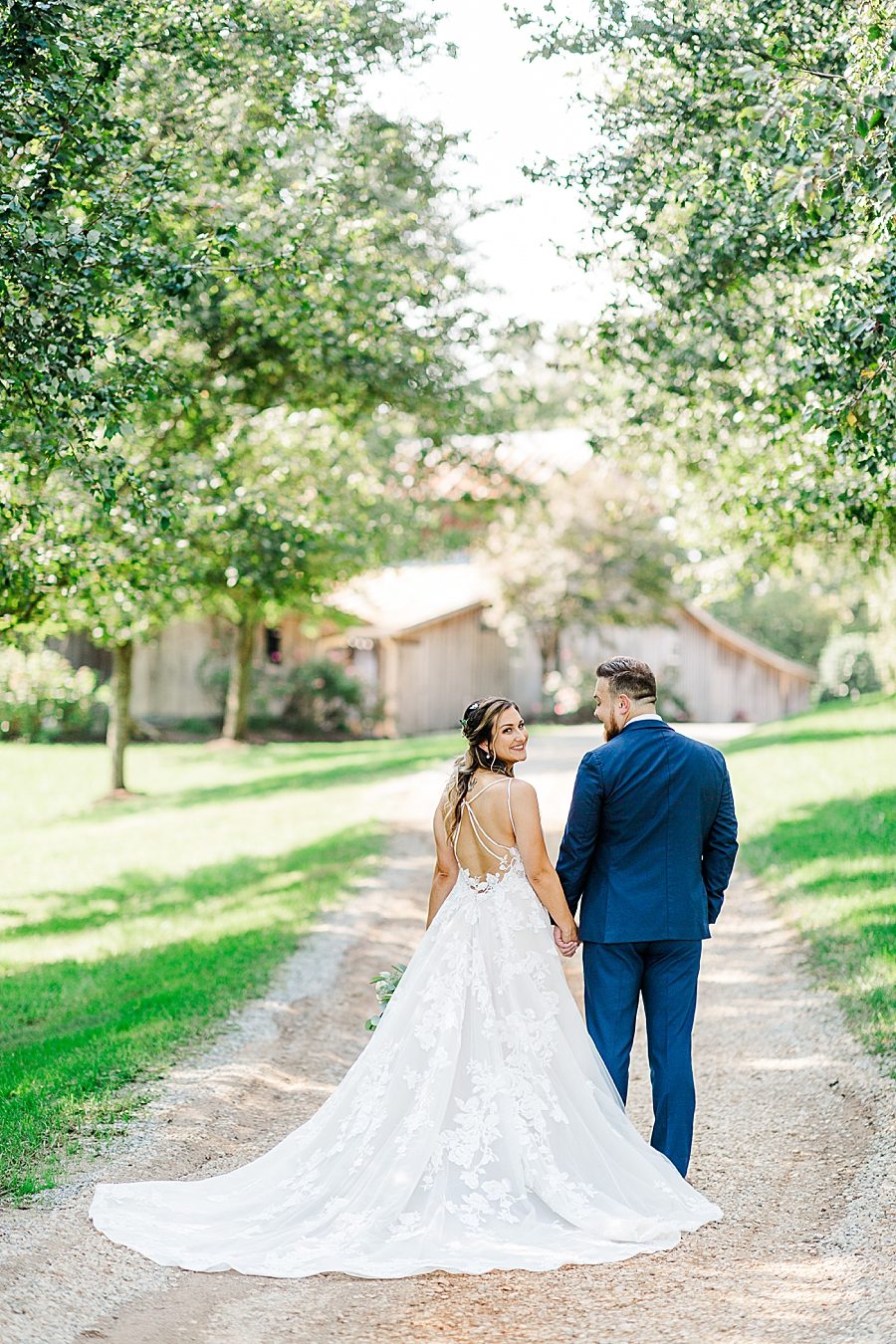 holding hands and walking at this castleton farms wedding