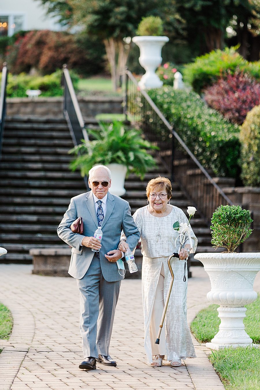 grandparents walking down the aisle at this castleton farms wedding