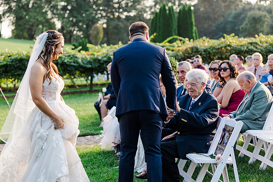shaking grandfather's hand at this castleton farms wedding
