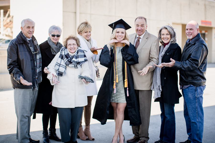 Family with their hands out at this University of Tennessee graduation by Amanda May Photos.