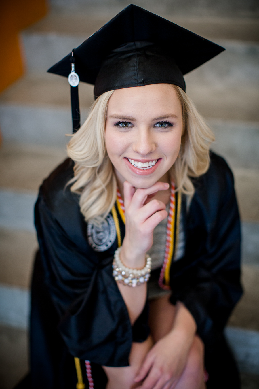 Graduate sitting down at this University of Tennessee graduation by Amanda May Photos.