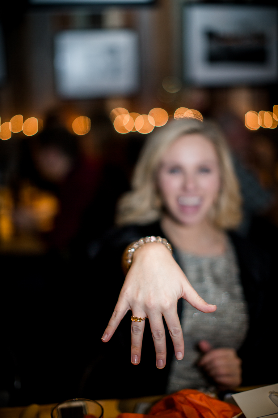 Showing the camera her graduation ring at this dinner at Sunspot after the University of Tennessee graduation by Amanda May Photos.