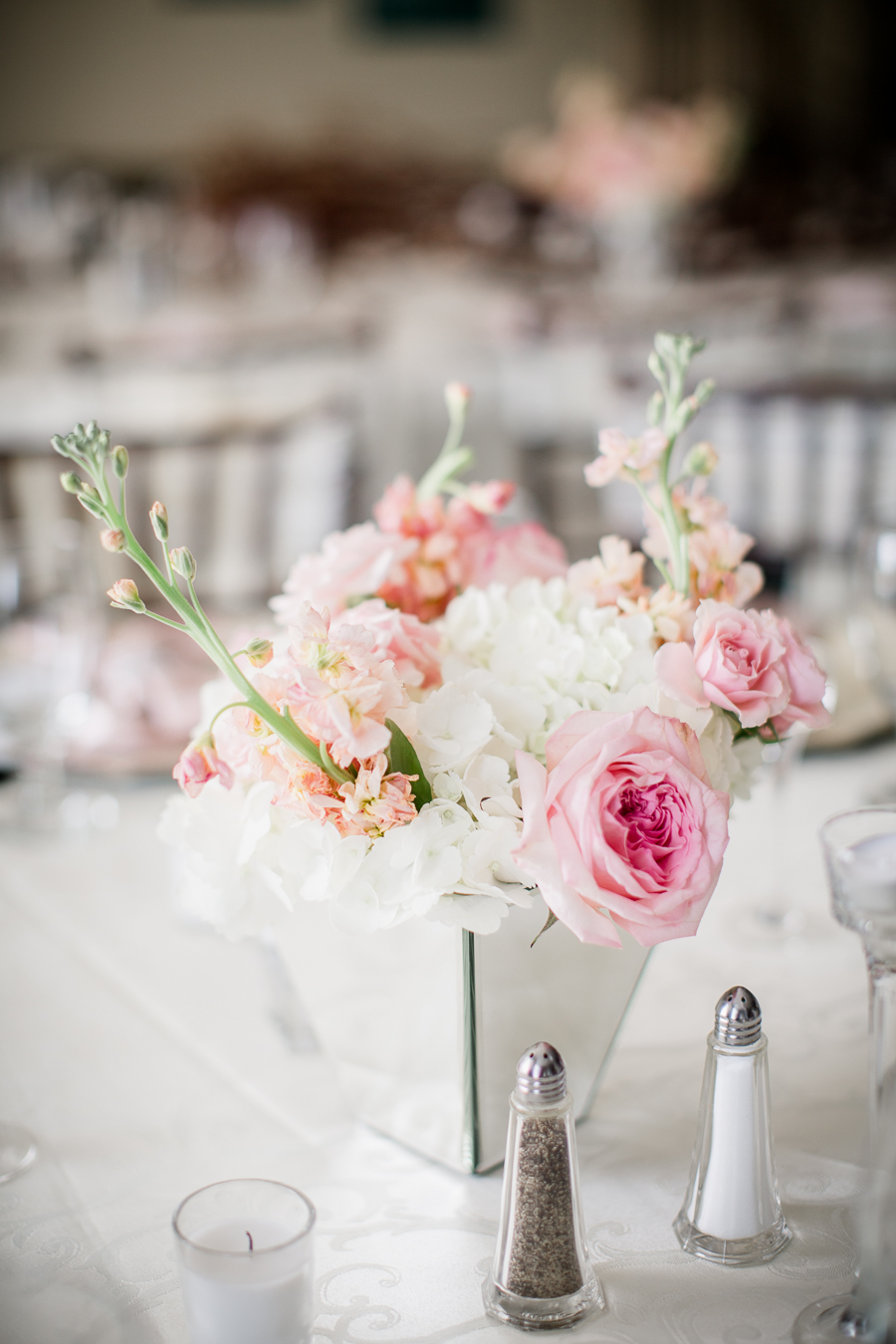 Detail shot of flower arrangement on table at this Daytona Beach Wedding by Destination Wedding Photographer, Amanda May Photos.