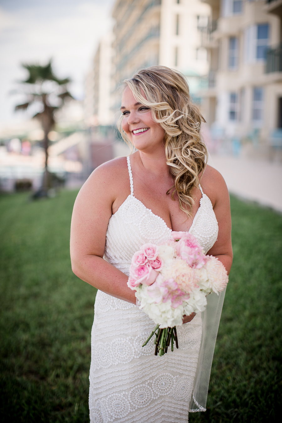 Close up of bride looking at beach at this Daytona Beach Wedding by Destination Wedding Photographer, Amanda May Photos.