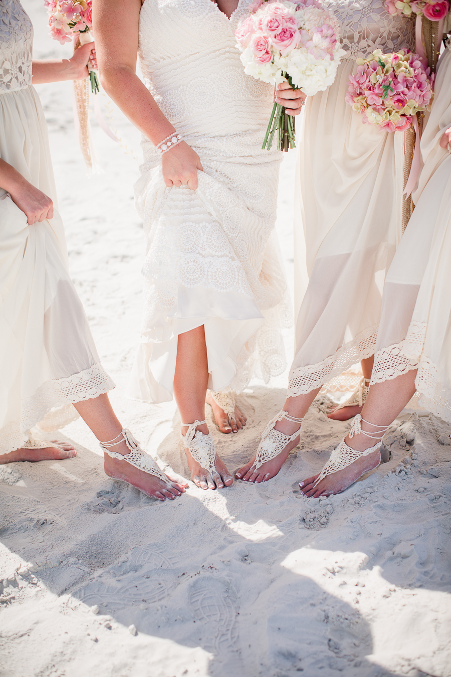 Showing off their sand shoes at this Daytona Beach Wedding by Destination Wedding Photographer, Amanda May Photos.