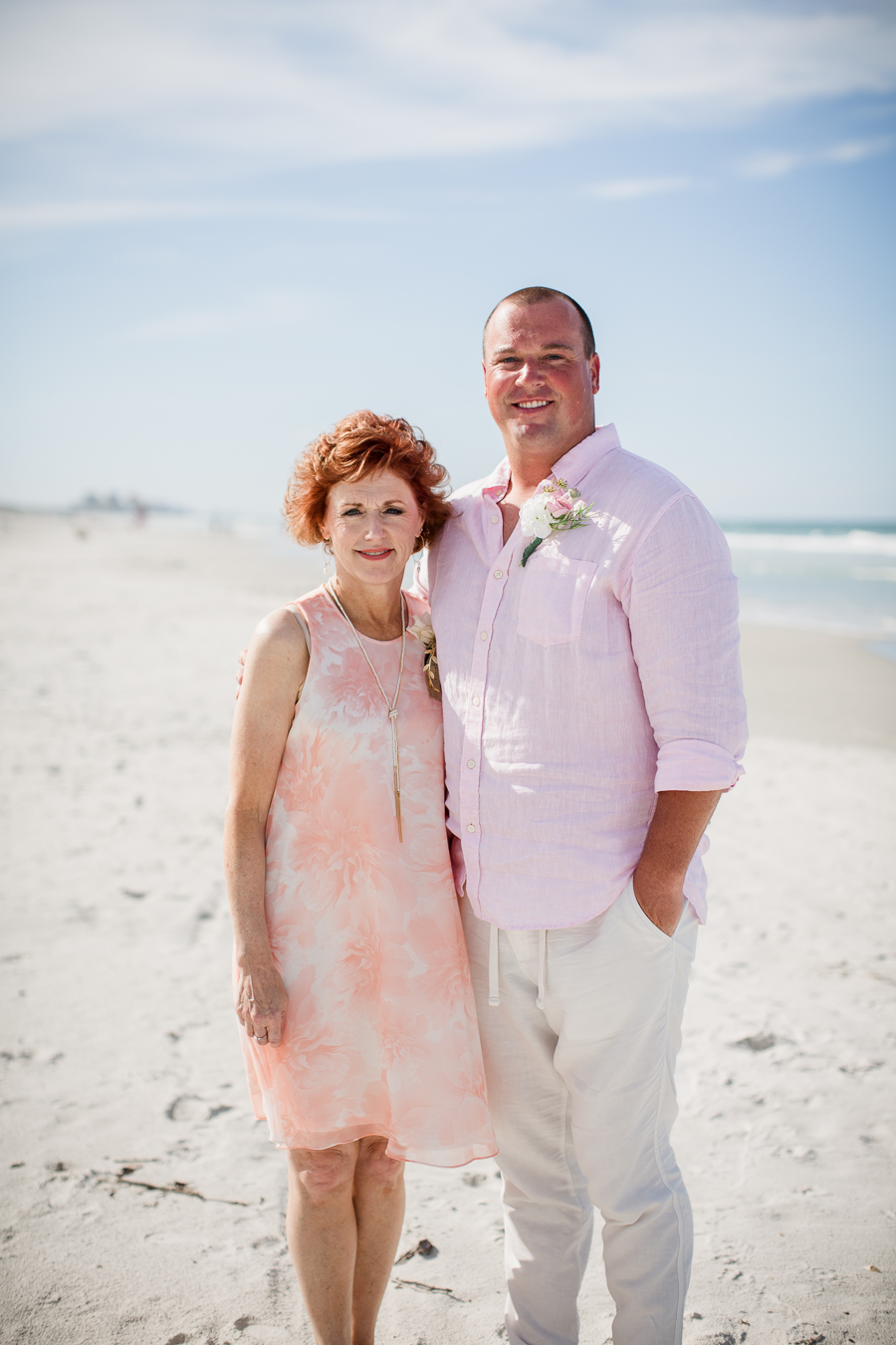 Groom with mother on beach at this Daytona Beach Wedding by Destination Wedding Photographer, Amanda May Photos.