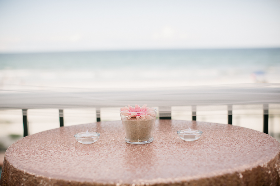 Table setting with beach in background at this Daytona Beach Wedding by Destination Wedding Photographer, Amanda May Photos.