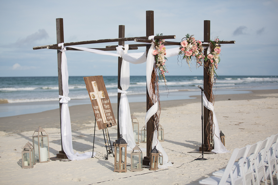 Wooden archway on beach at this Daytona Beach Wedding by Destination Wedding Photographer, Amanda May Photos.