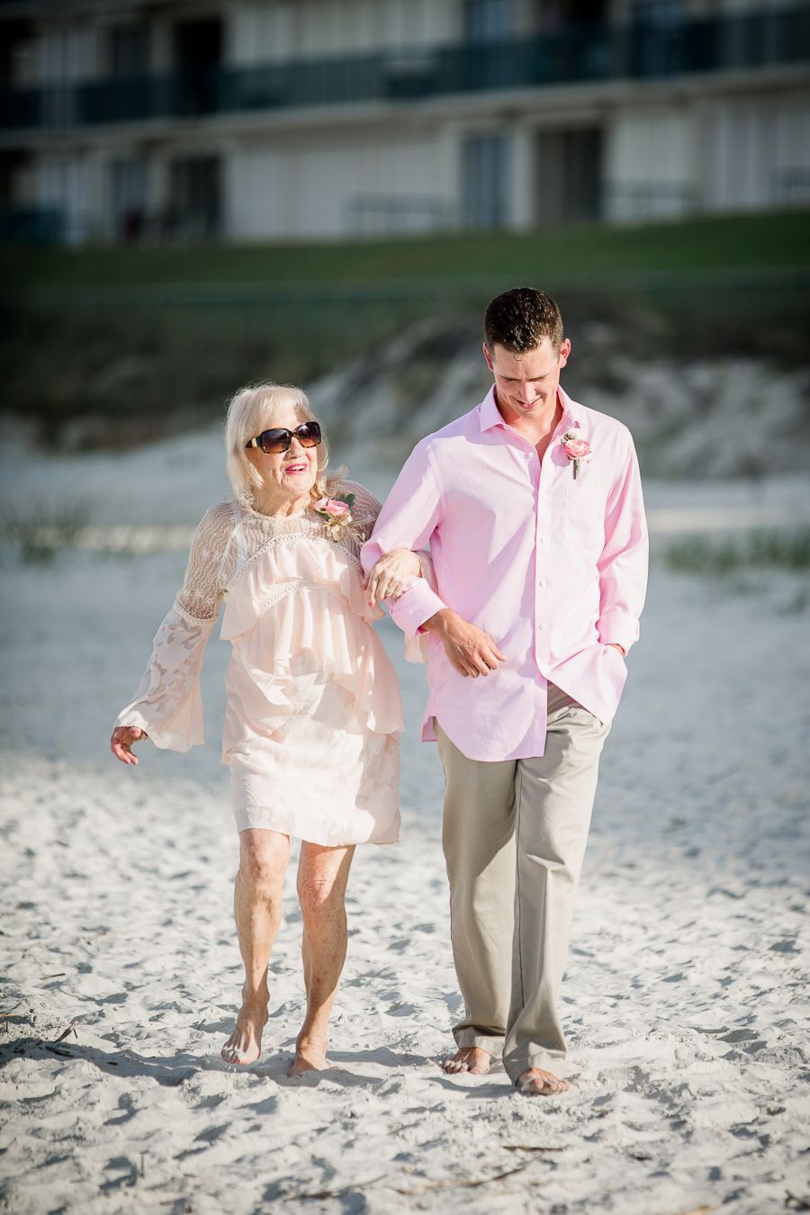 Being escorted down the beach at this Daytona Beach Wedding by Destination Wedding Photographer, Amanda May Photos.